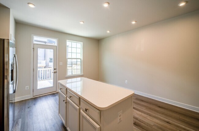 Building Photo - This 3-bedroom, 3-full bathroom townhouse offers a pristine and contemporary living experience.
