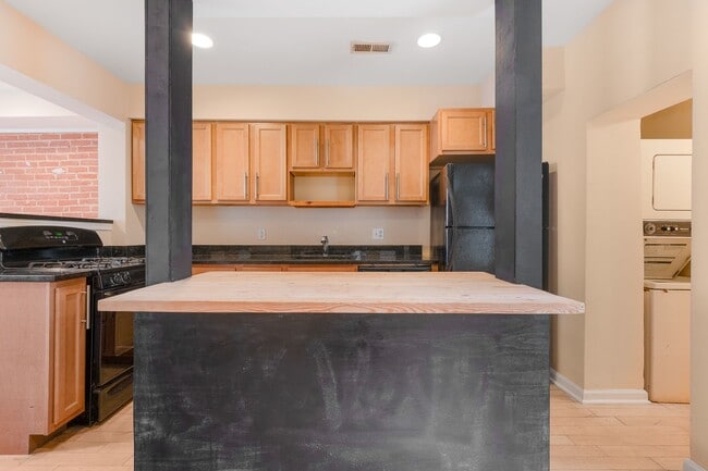 Building Photo - Spacious 2BR/2.5BA Townhome with Finished Basement & Extra Storage