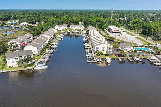 Building Photo - WATERFRONT LIVING! BEAUTIFULLY APPOINTED CONDO ON THE BAYOU IN OS SCHOOL DIST - FULLY FURNISHED