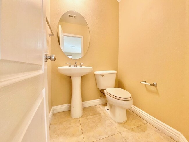 Building Photo - THIS SPACIOUS RESIDENCE FEATURES 4 BEDROOM...