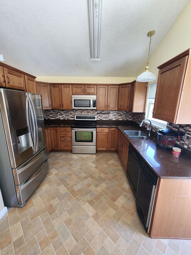 Building Photo - Spacious 4-Bedroom Home with RV Parking in...