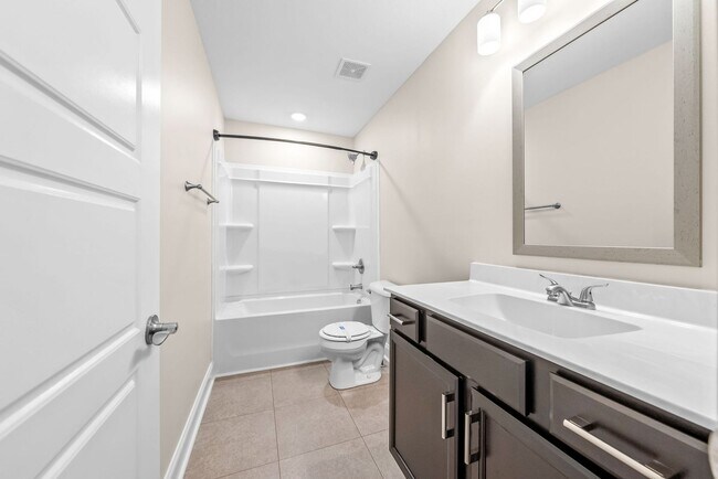 Building Photo - Pet Friendly Three Bedroom with Bonus!