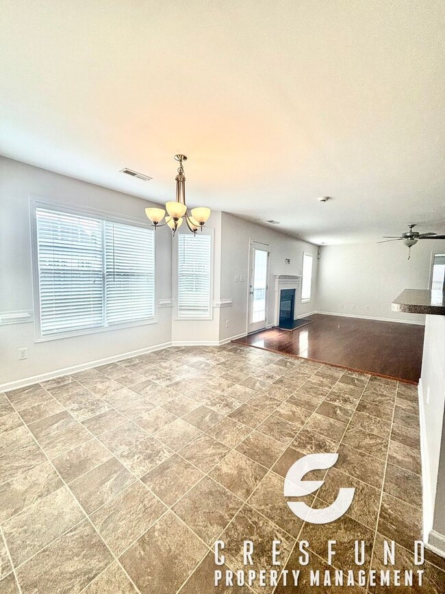 Building Photo - Freshly Painted and Spacious 4 Bedroom, 3 ...