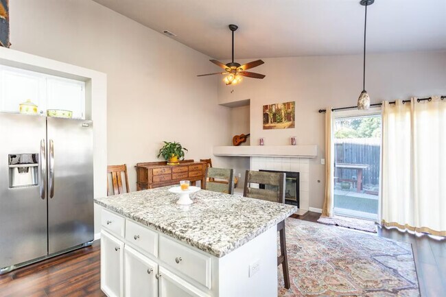 Dinner Area_Fire Place & back door to back yard - 9316 Caulfield Dr