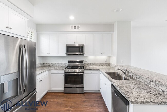 Building Photo - Modern Tri-Level Townhome with Office, 2-Car Garage & Prime Anaheim Location!