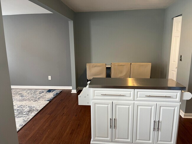 The kitchen has a movable kitchen island for more cooking space. - 7837 Heaton Way