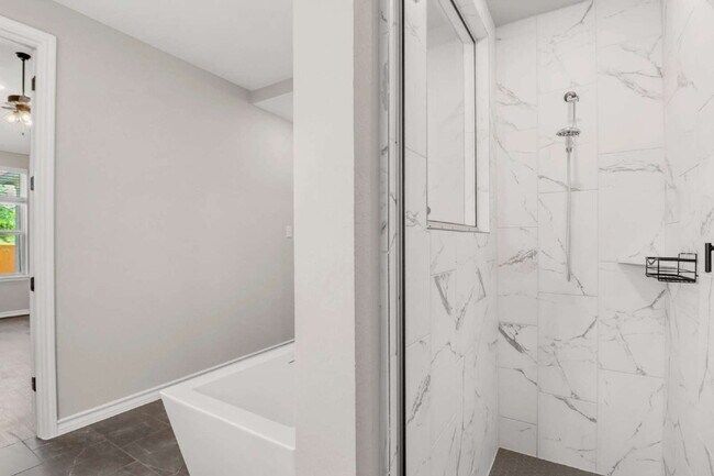 Building Photo - ASK ABOUT FREE APPLICATIONS THROUGH AUGUST!  "Spacious 4-Bedroom Sanctuary with Cozy Fireplace in...