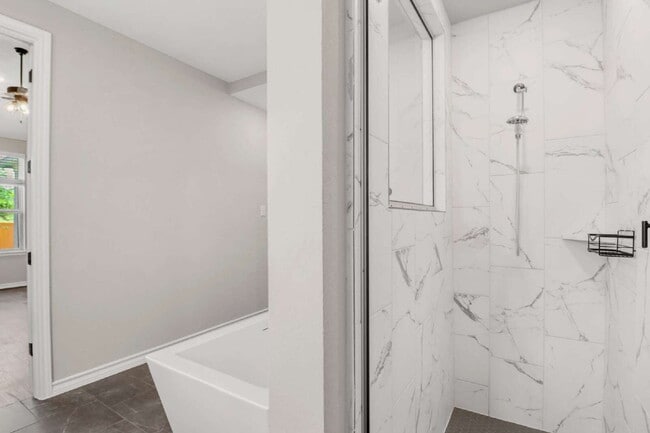 Building Photo - "Spacious 4-Bedroom Sanctuary with Cozy Fireplace in San Antonio's Prime Location!"