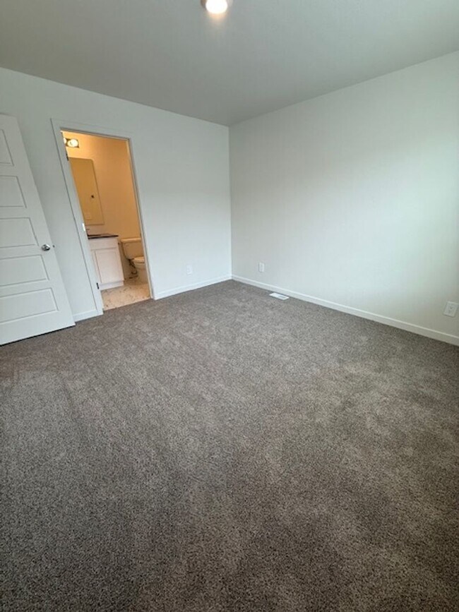 Building Photo - New 2 Bedroom Townhome + 2 Car Garage