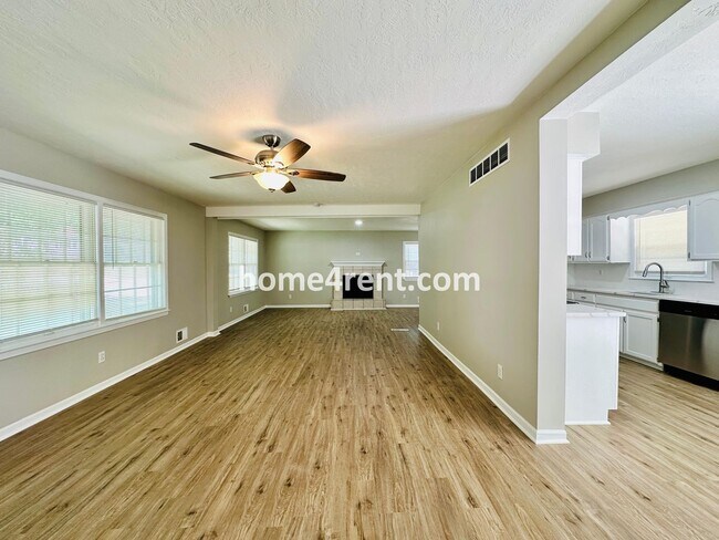 Building Photo - Like New, Ranch Style Home in Raytown - Wood Floors, Finished Basement, Fenced Yard!