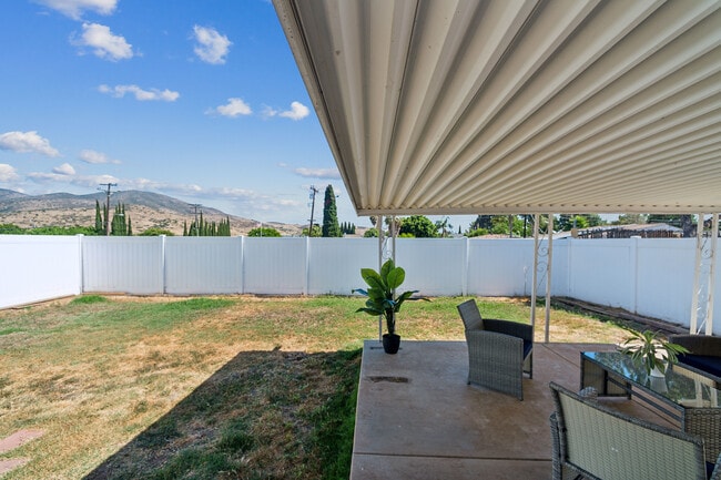 Enjoy the backyard patio, a great space for outdoor dining. - 9853 Saint George St