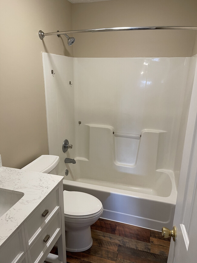 New vanities and toilets, curved shower curtain rod - 705 Candlewood Dr