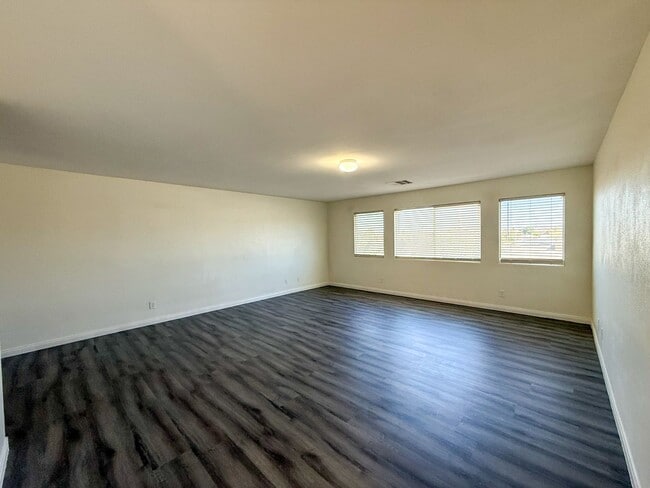 Building Photo - SPACIOUS HOME IN GATED COMMUNITY WITH POOL, RV PARKING & 4-CAR GARAGE!