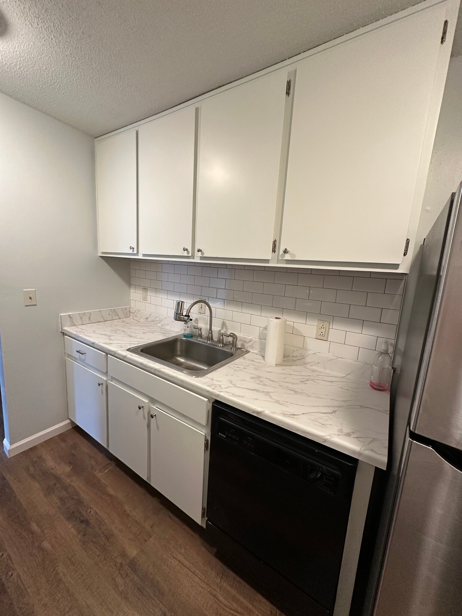 Kitchen: stainless steel refrigerator with freezer and ice maker, tiled backsplash - 1177 Church St