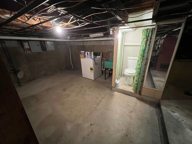 Basement w/ washer, dryer, and quarter bath - 136 Hall St