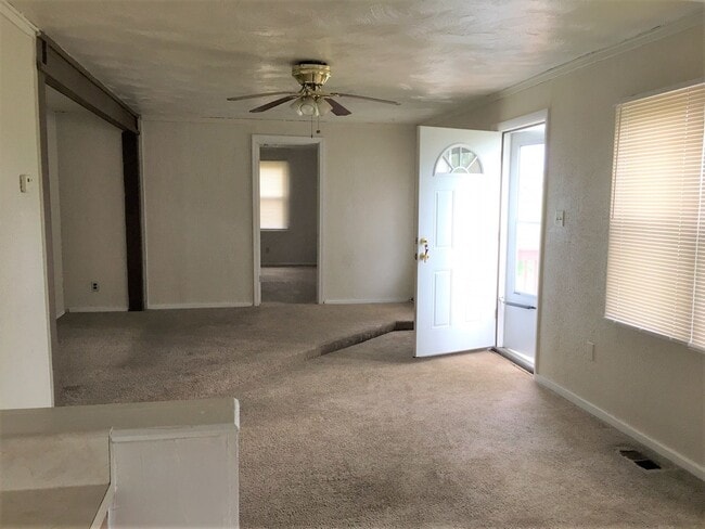 Building Photo - Three Bedroom Home with Main Floor Laundry on a Large Acre + Lot!!