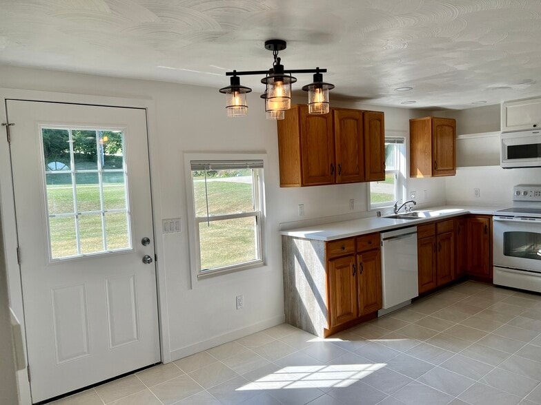 Kitchen and back door, new tile floors, lots of cabinet space - W4493 Spruce Dr