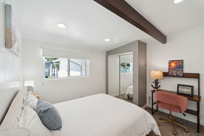 Work and unwind! This bedroom features a cozy workspace, perfect for productivity and relaxation - 9853 Saint George St