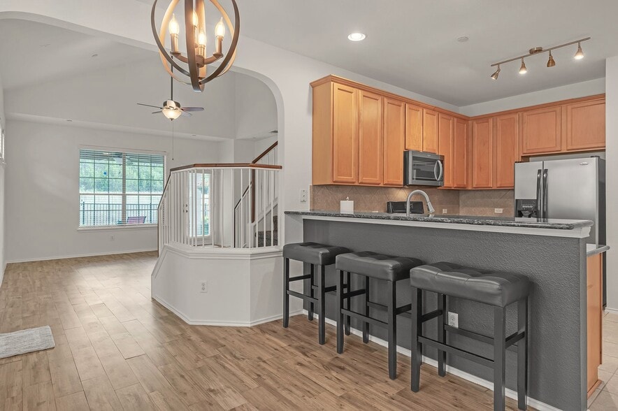 Bar area and kitchen - 9201 Brodie Ln