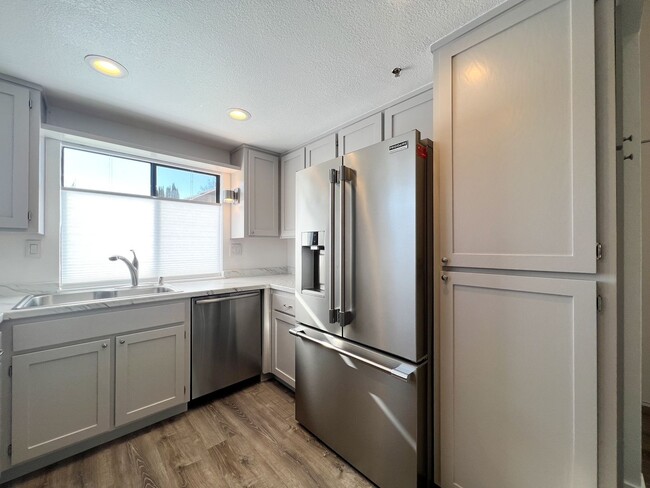 Building Photo - Beautifully Remodeled 2-Bedroom, 2-Bathroom Townhome with Single-Car Garage