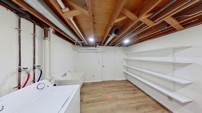 Building Photo - Updated two bedroom duplex, new stainless steel appliances, garage, and hardwood floors