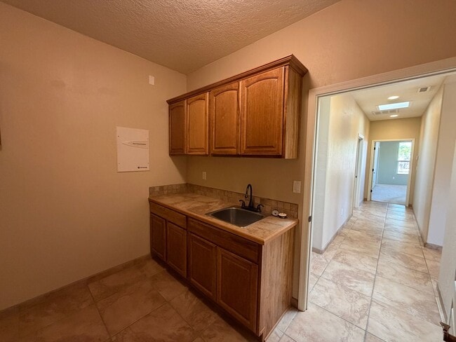 Building Photo - 4 Bedroom Single Story Custom Home Available In Rio Rancho Near Unser Blvd SE & Westside Blvd SE!