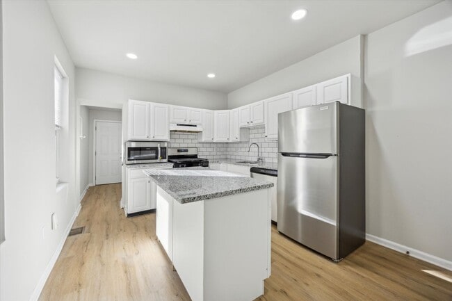 Building Photo - Stunning 4-Bedroom Townhome in the Heart of Francisville! Available NOW! Last Month’s Rent waived...