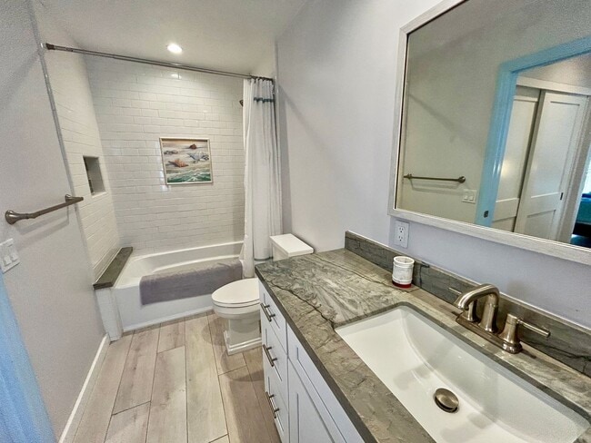 Building Photo - Steps to the beach from this Ocean View Condo with 2 car garage