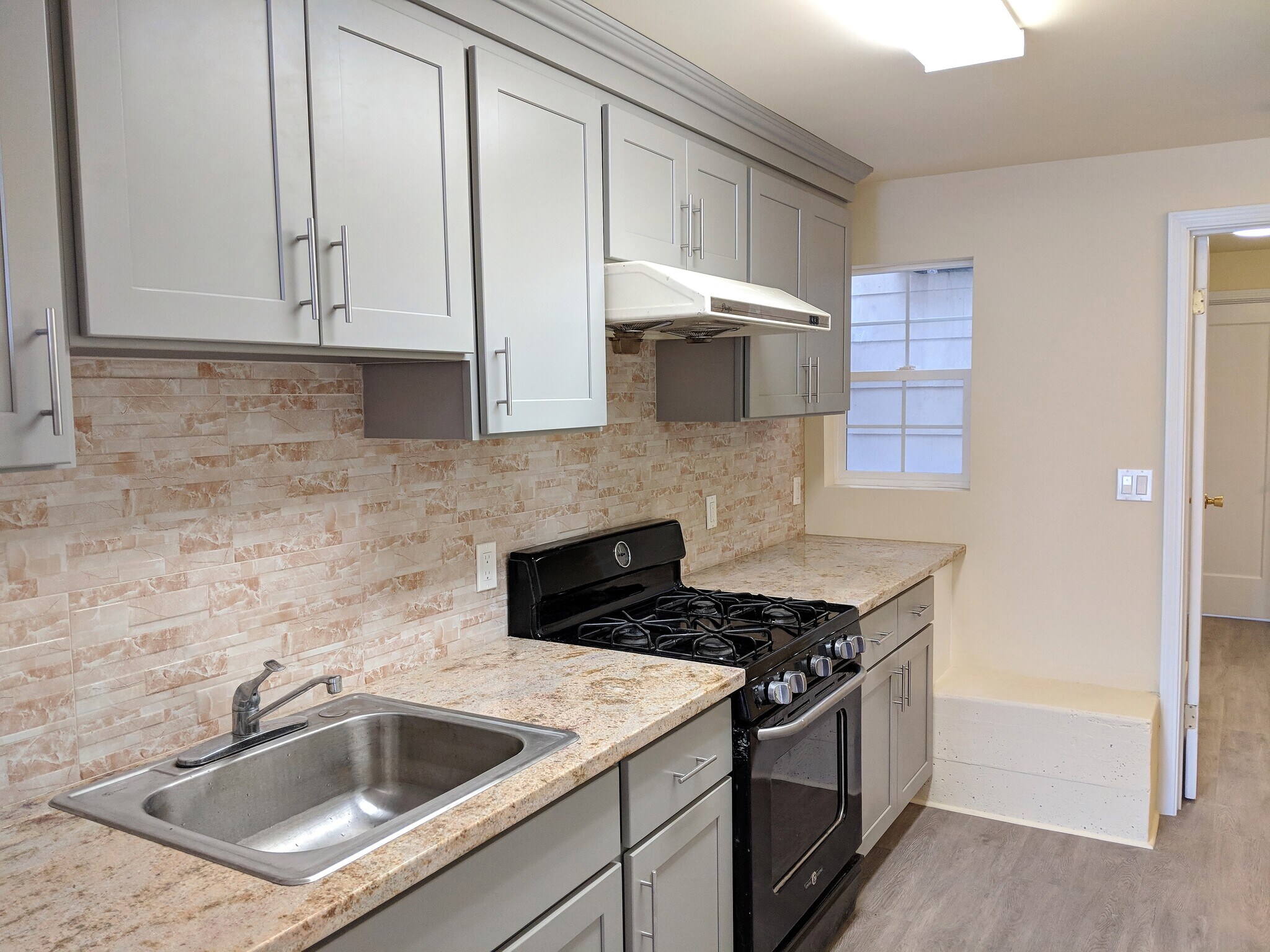 Kitchen area with brand new countertops and cabinets - 267 Irvington Street