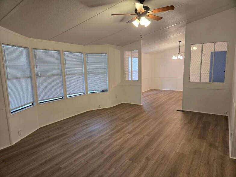 Living Room with Bay window lookin out on porch - 2320 Delmar Rd