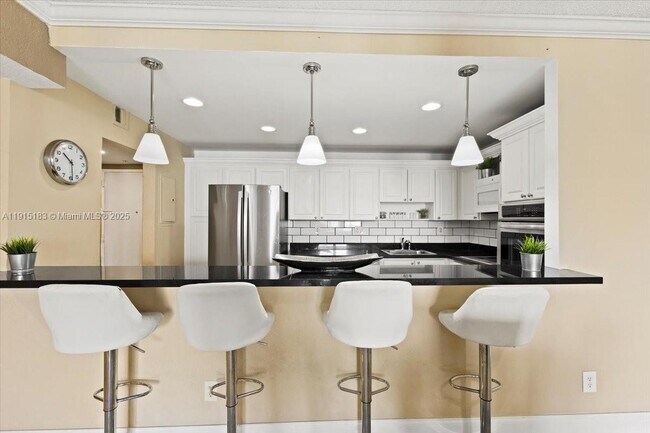 Building Photo - 19380 Collins Ave