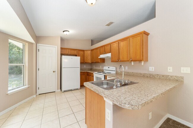 Building Photo - Peaceful 3-Bedroom Home with Open Floor Plan & Two-Car Garage in Rainbow Lakes Estates!