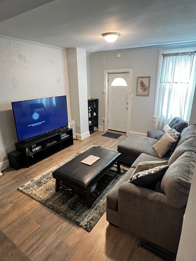 Living room with front door - 511 W Philadelphia St