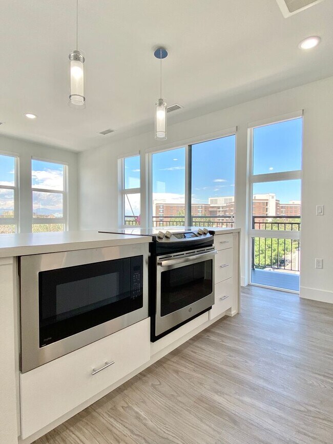 Building Photo - Luxury Top-Floor Condo with Stunning Mountain & City Views