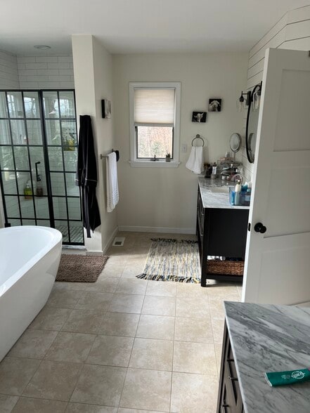 Primary bathroom with two large sink units and beautiful soaking tub - 45 Pentland Hills Dr