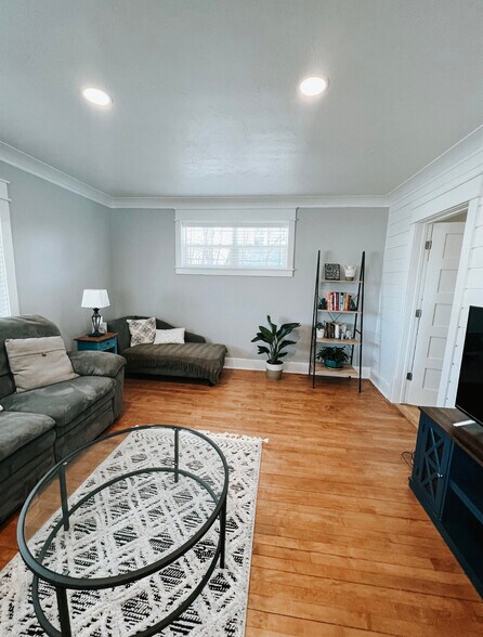 Our living room has plenty of room and seating for a family. Smart TV includes streaming services. - 624 Park St