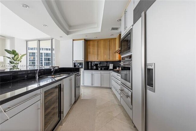 Building Photo - 10295 Collins Ave