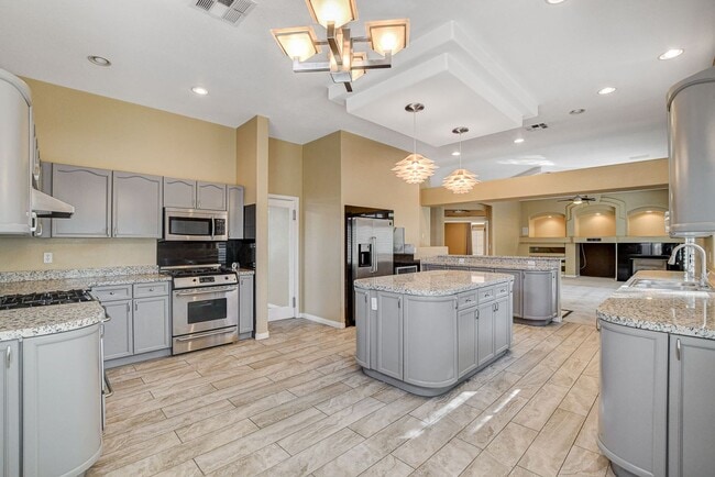Building Photo - Luxury 5-Bedroom Guard-Gated Home with Pool, Spa & 3 En-Suite Bedrooms