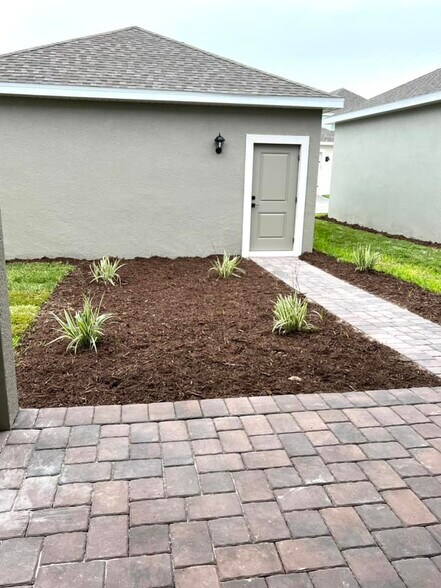 Outdoor 2 car garage and outdoor entertaining space. - 14990 Lebeau Loop