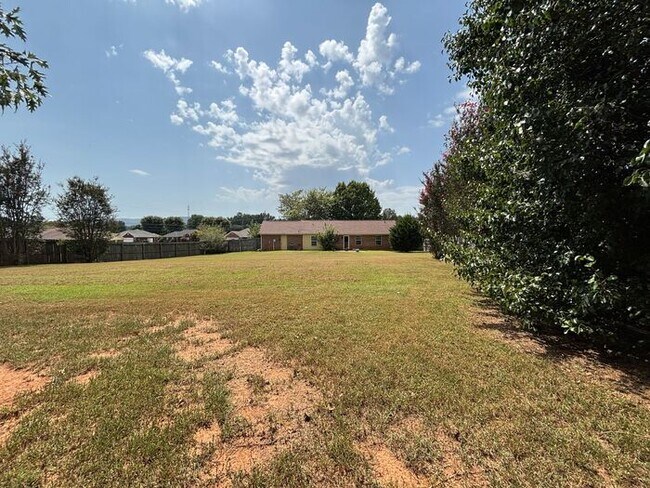 Building Photo - You will LOVE the fenced yard!