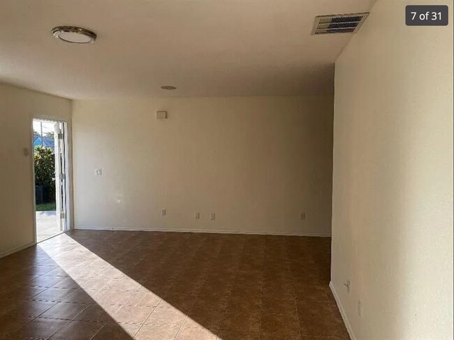 Building Photo - 2/2/1 home with a spacious fenced backyard...