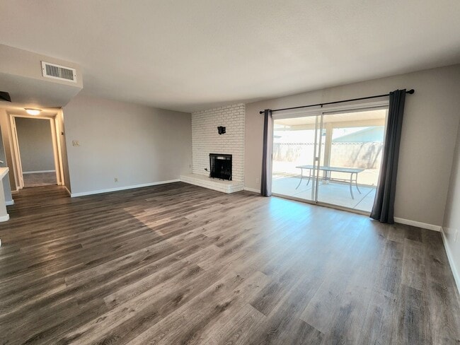 Building Photo - 4 Bedroom Two-Story Home with Downstairs Primary Bedroom & Fireplace