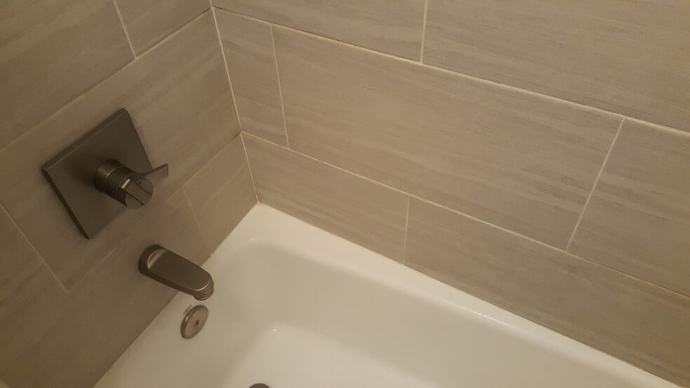 Bath with modern tile and brushed nickel fixtures - 2261 Blake Street