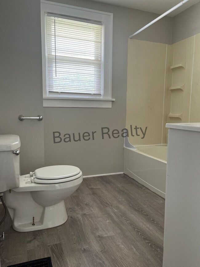 Building Photo - Three bedroom home with two car, detached garage!