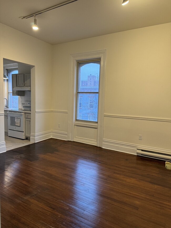 Refinished wood floors add warmth to living area - 118 Philip St