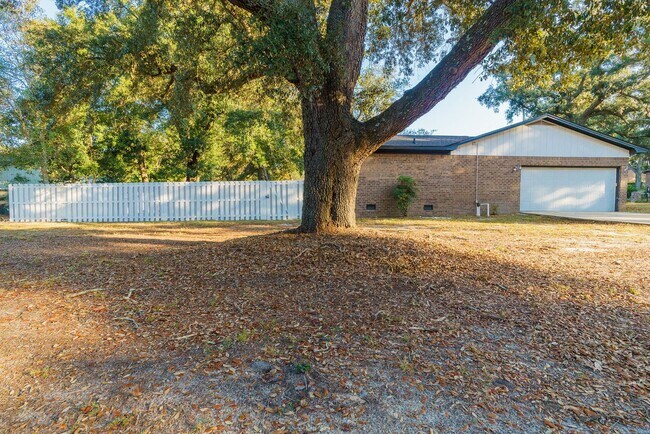 Building Photo - Charming Corner Haven 4BR/3BA Brick Home for Rent