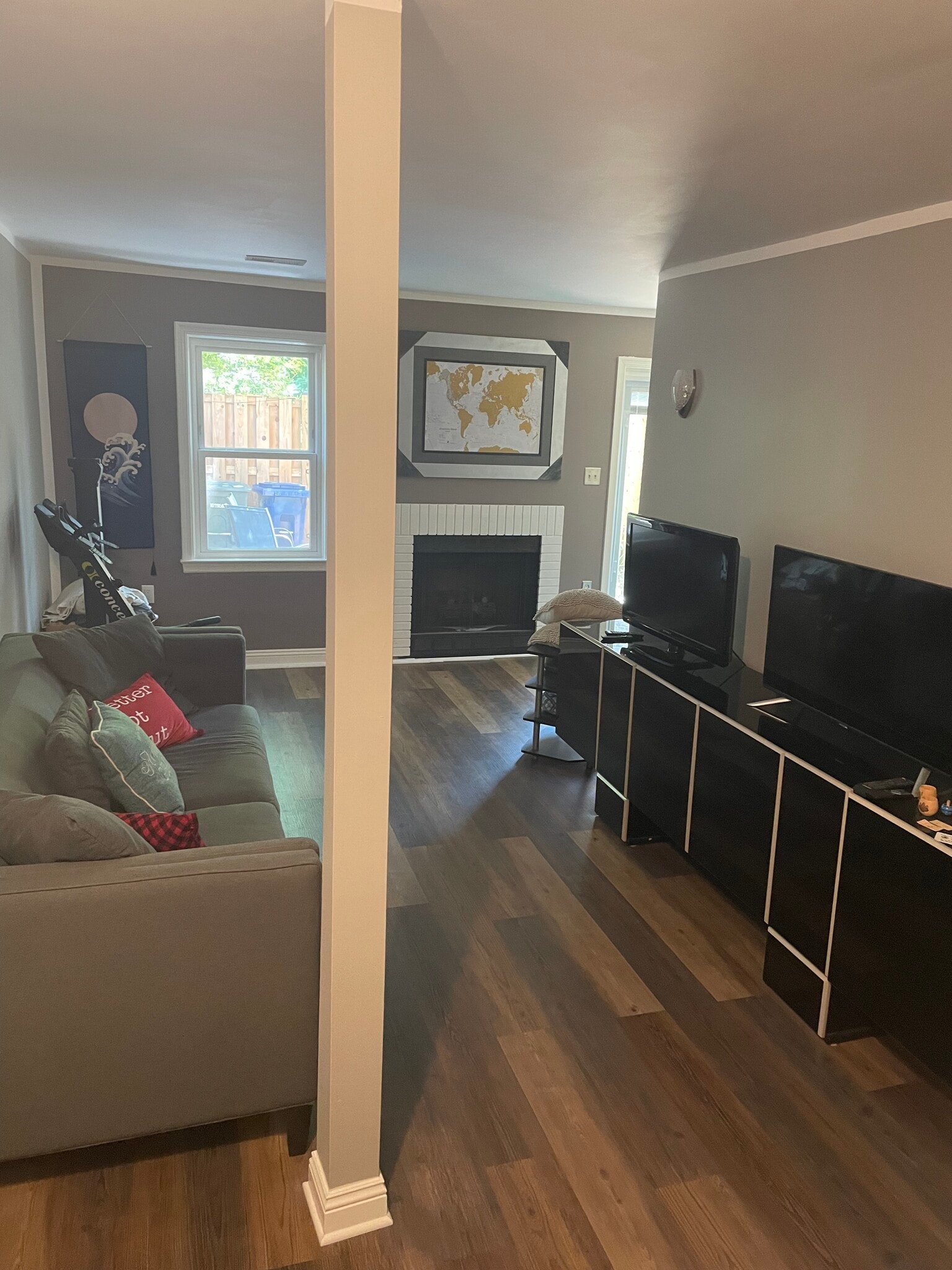 Basement FURNISHED: w/ couch, art, TV, & entertainment center - 3814 Usher Ct