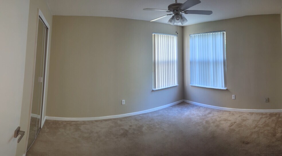 Unfinished room featuring: Walk in closet, full length mirror, built in blinds, & blackout curtains - 3145 Britannia Blvd