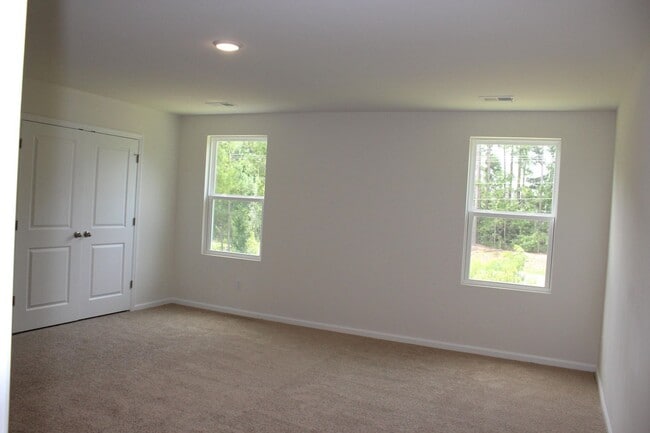 Building Photo - Sun-Filled 3-Story End-Unit Townhome with Fenced Yard, Storage & Resort-Style Pool