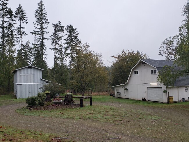 Garage/workshop to the right, barn center, and carport to the left - 11839 Glenwood Rd